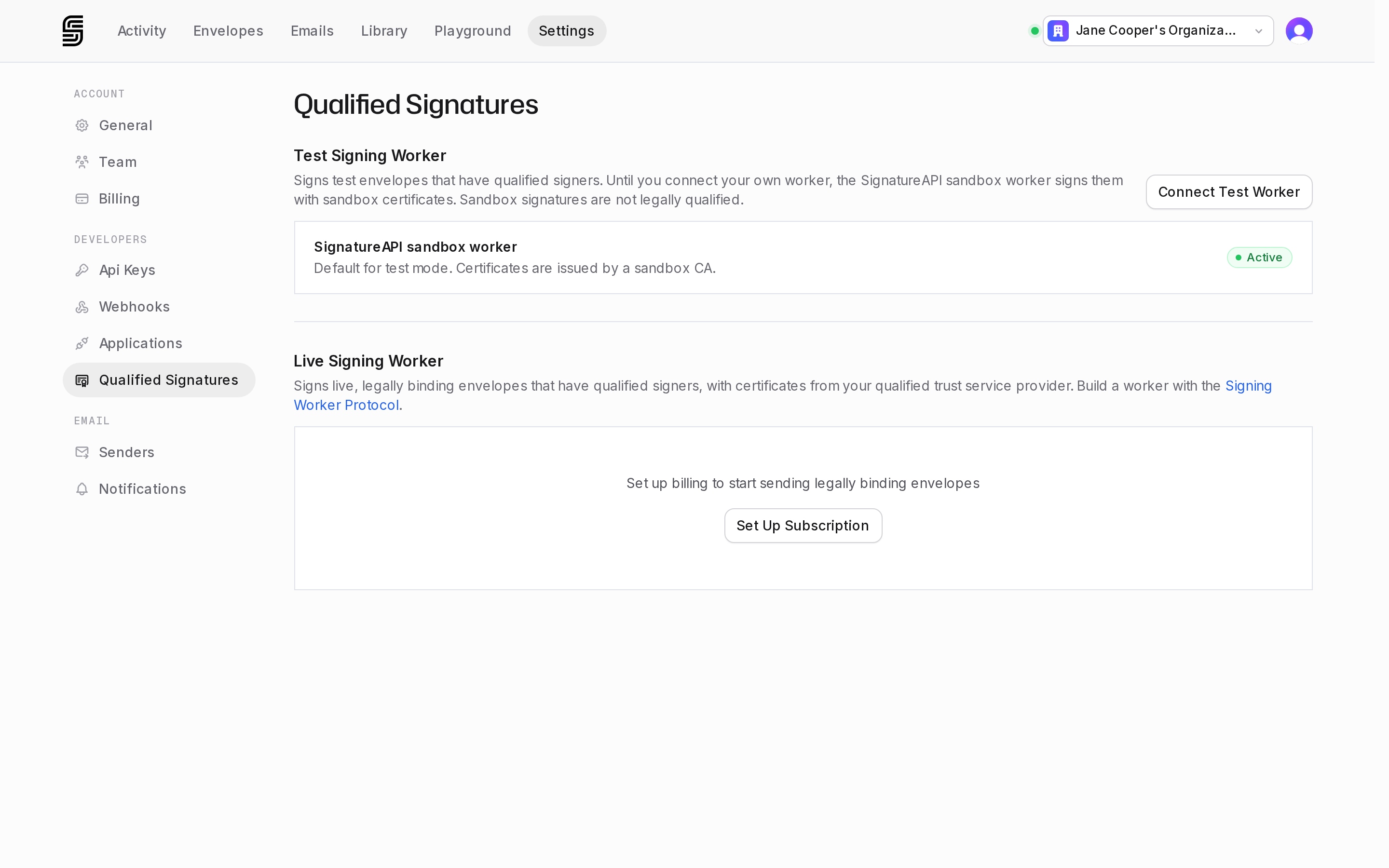 Qualified Signatures settings on a trial account: the test section uses the SignatureAPI sandbox worker and the live section shows Set Up Subscription